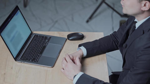 Man speaks by gesturing with his hands