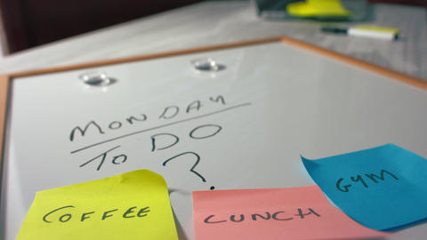 Monday morning schedule sticky notes on whiteboard
