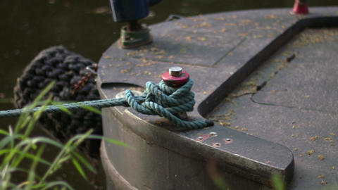 Boat tied with a rope on moorings