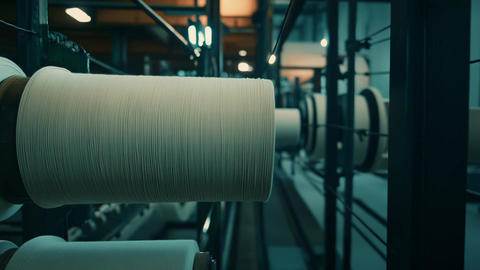 Textile factory producing yarn spools on machinery