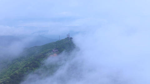 Aerial view of Seongjusan Mountain summit and rolling fog
