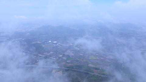 Aerial view of Seongjusan Mountain summit and rolling fog