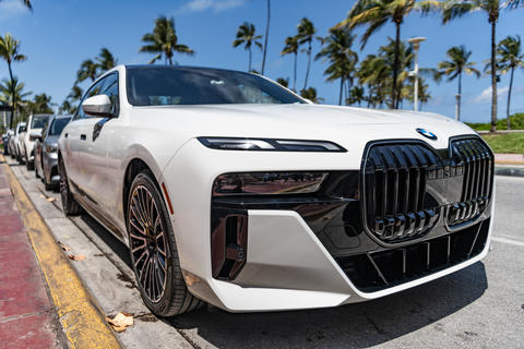 Miami, Florida, USA - May 06, 2025: Car BMW X7 parked outdoor. White SUV car, corner view. BMW X7