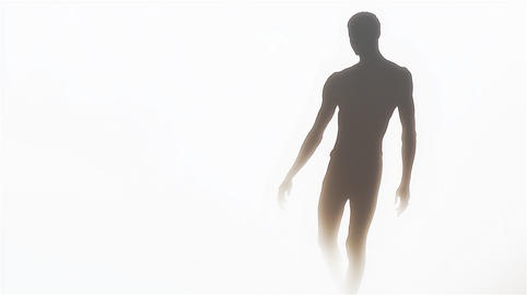 Mysterious Human Silhouette Emerging Through Mist and Light