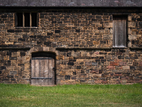 Old Medieval building with wooden door Monk Bretton Priory