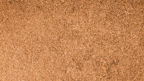 Copper metallic textured surface creating abstract grainy background