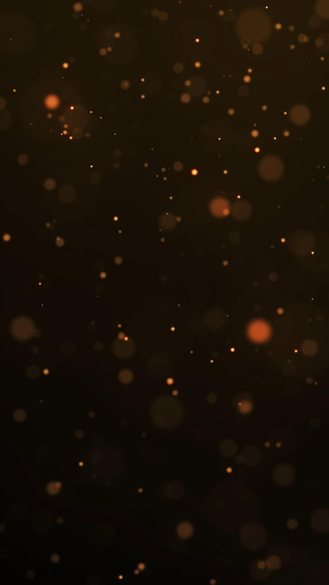 Warm golden bokeh particles on dark background for luxury festive, cinematic awards