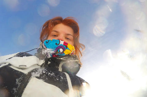 Portrait of Woman Snowboarder Skiing in Snowy Mountains Winter in sport Resort