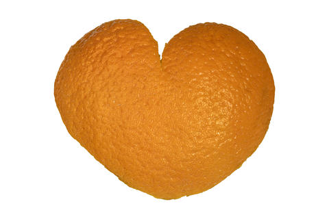 Heart shaped citrus peel texture symbol of natural vitamin freshness