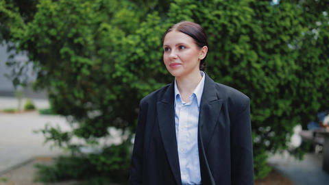 Smiling Professional Woman Standing Outdoors, Confident Expression