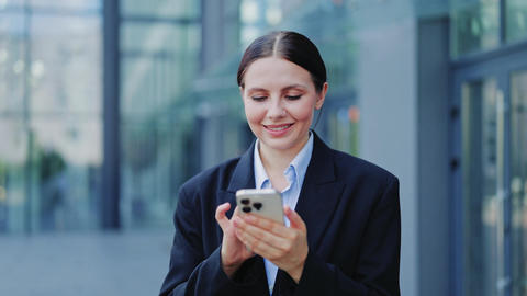 Smiling Business Professional Interacting with Smartphone