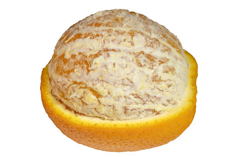 Partially peeled citrus orange fruit showing textured rind and pulp