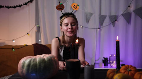 Cute Little Girl Blowing Out A Candle