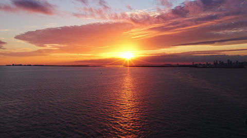 Sunset cloudy sky. Seascape at summer vacation. Skyscape with sea horizon. Horizon sunrise sea with