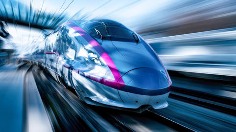 High-speed train racing through a station tunnel with motion blur, modern rail transport, rapid trav