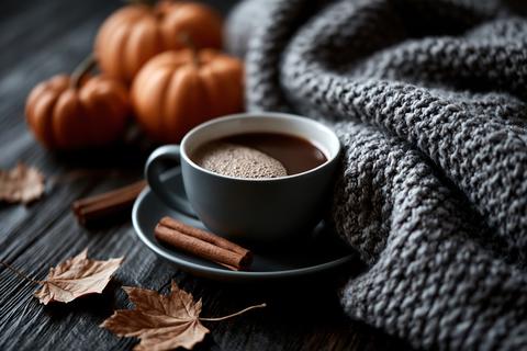 Cozy autumn flat lay pumpkins knitted blanket hot coffee fall