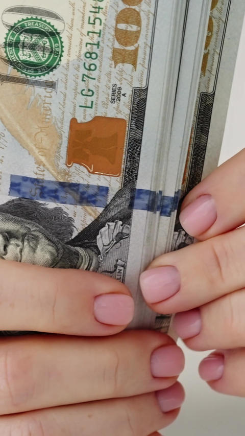 Woman hands counting dollar bills cash close up finance savings money concept