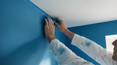 Satisfying, peeling painter's tape to reveal a perfect clean line