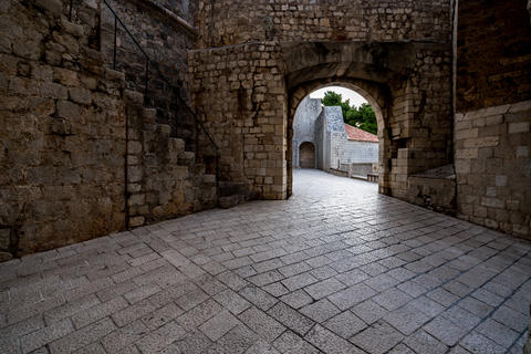 Tourists Walking Through Dubrovnik Old City Gate Stone Arch