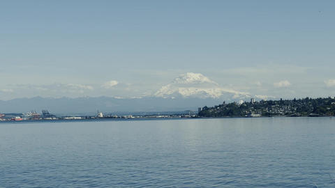 Calm bay with Mount Rainier on horizon