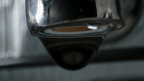Close-up view of water dripping from a tap