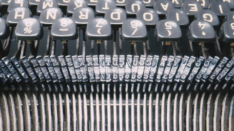Close-up of a vintage typewriter keyboard and mechanism with camera focus movement