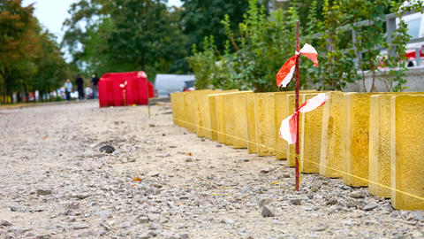 Road works.Laying pedestrian tiles with relief for the blind