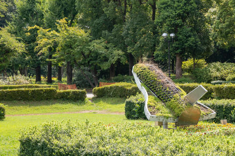Space Shuttle Garden Sculpture Covered in Moss and Greenery in a Park