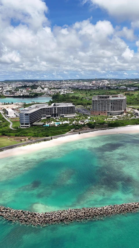 Vertical Aerial Drone Footage of Miyakojima Sunset Beach and Ocean Resort