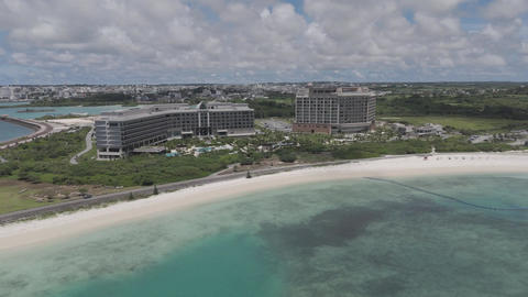 Log Aerial Drone Shot of Sunset Beach and Resort Area in Miyakojima