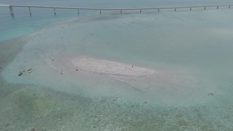 Log footage of Yuni no Hama beach, Miyakojima Okinawa, drone orbiting the coastline in summer