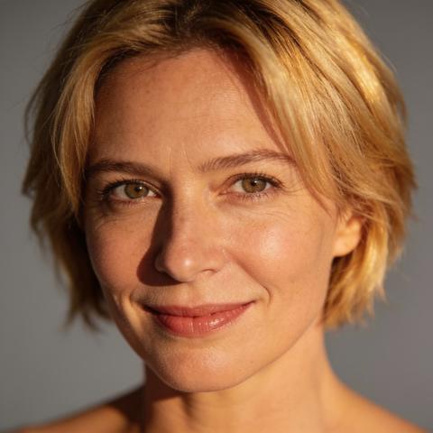 Confident Mature Woman Portrait with Short Blonde Hair and Warm Professional Lighting
