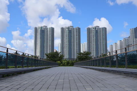 Korean Urban Landscape with High-Rise Apartments and Pedestrian Bridge