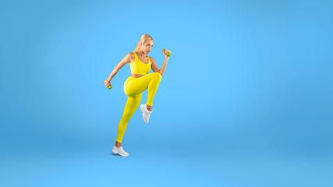 Focused Young Woman Exercising With Dumbbells, Yellow Fitness Outfit, Gym