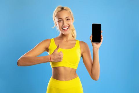 Smiling Young Female Holding Smartphone Giving Thumbs Up, Positive Vibe, Weight