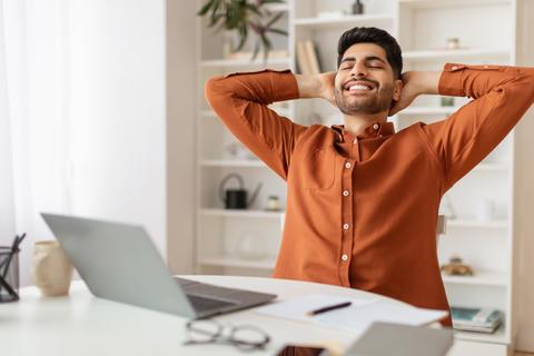 Smiling Young Middle Eastern Man Relaxing At Home Office, Weight Loss Concept