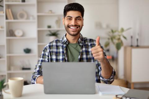 Smiling Young Asian Man Working On Laptop At Home Office, Positive Vibe