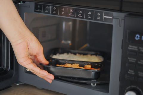 Microwaving rice and chicken meal