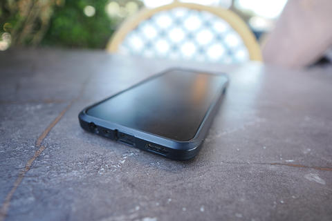 Smartphone placed on a table in an outdoor setting. lost smart phone concept