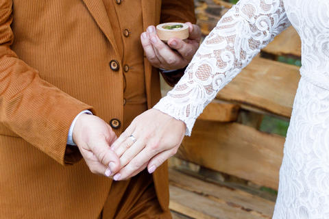 The bride and groom s hands with their wedding rings during the wedding ceremony