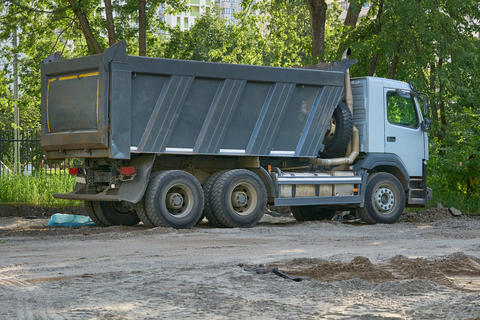 Construction transport.Big dump truck carrying bulk cargo