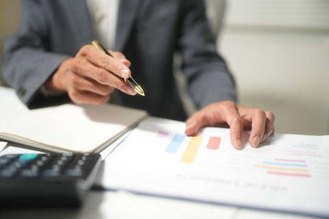 Businessperson Reviewing Financial Charts