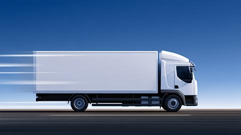 White delivery truck transporting goods at high speed