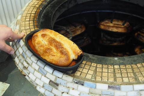 Freshly baked bread taken from a traditional oven in a bakery