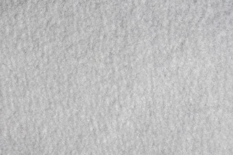 Soft fibrous gray felt textile surface close up detailed texture