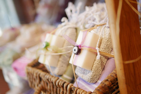 Soap bars wrapped in string placed in a woven basket at a shop