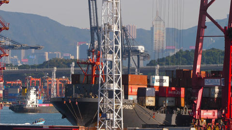 Container ship loading cargo at Hong Kong port terminal