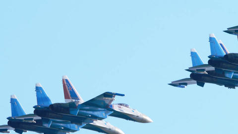 Russian Knights fighter jets flying in formation at airshow