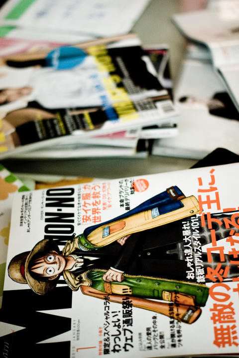 Stack of Japanese Magazines and Comics on a Desk