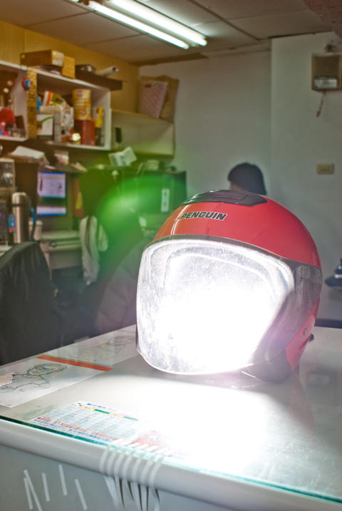 Red Motorcycle Helmet Lit by a Bright Light